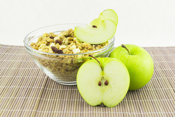 Cereal and an apple on the mat