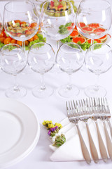 Buffet table with dishware waiting for guests