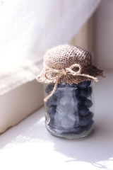 Fresh blueberries on window sill