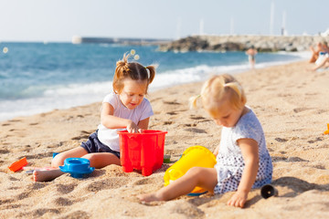 girls playing on  beach