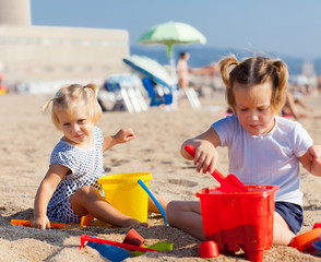 girls playing on  beach