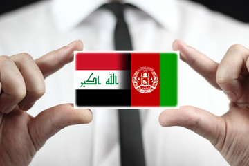 Businessman holding Iraq and Afghanistan Flag