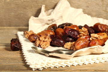 Tasty dates fruits on wooden table
