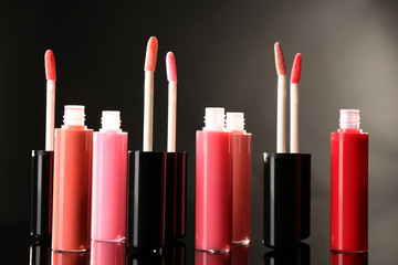 Beautiful lip glosses on dark background