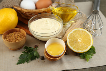 Mayonnaise ingredients on wooden background