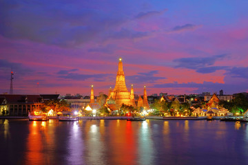Twilight time of Wat Arun across ChaoPhraya River during sunset