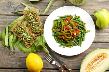 Healthy salad with peas and asparagus served