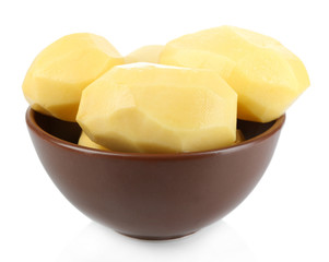 Raw peeled potatoes in bowl isolated on white