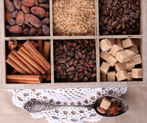 Wooden box with set of coffee and cocoa beans, sugar cubes,