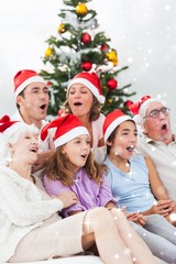 Extended family singing christmas carols