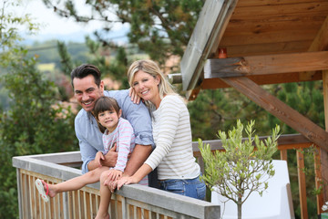 Family enjoying vacation in log cabin