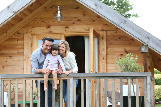 Family enjoying vacation in log cabin