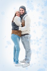 Attractive young couple in warm clothes hugging