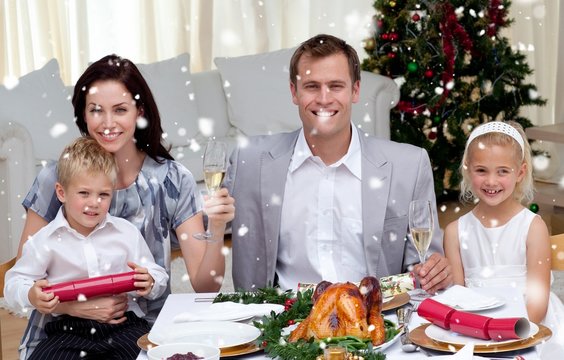 Parents toasting with champagne in christmas dinner