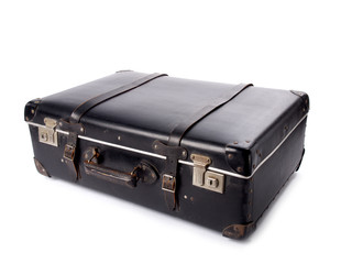 An old black vintage leather suitcase with straps and locks
