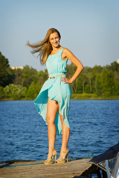 skinny girl on the river quay