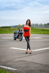 Fototapeta premium girl and a motorcycle