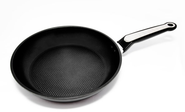 Black frying pan isolated on a white