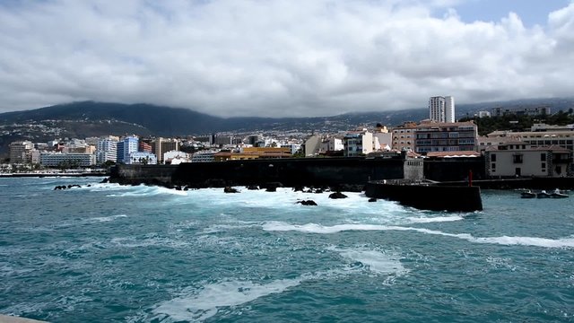 Coast of the Puerto de la Cruz city, Tenerife with big waves.