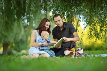 Fototapeta na wymiar Happy family reading a book