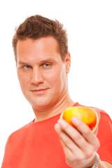 Happy man in red shirt holding apple. 