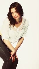 plus size woman in casual clothes posing in studio