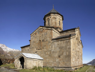 Fototapeta na wymiar Gergeti Trinity Church near the village Stepantsminda. Georgia