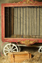 Empty cage for animals with gold ornament in circus