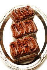 Close Up of Three Brownies on a Silver Platter