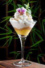 Passion fruit ice cream with almond cream and coconut foam
