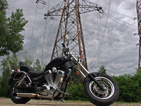 Motorbike among high voltage electricity cables
