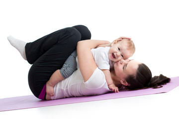 Fototapeta na wymiar mother with baby do gymnastic and fitness exercises