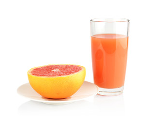 Studio shot sliced grapefruit on plate with juice isolated white