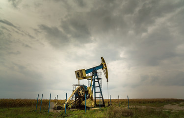 Fototapeta na wymiar Oil and gas well in remote rural area, profiled on dr