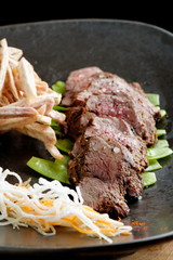 Lemongrass grilled beef steak with snow peas and taro potatoes