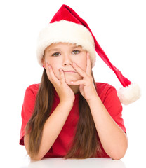 Young unhappy girl in christmas cloth