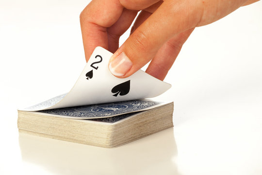 Woman hand holding a poker card