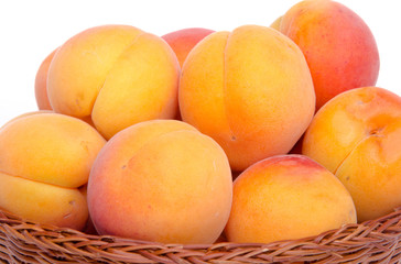 Fresh tasty apricots in a basket