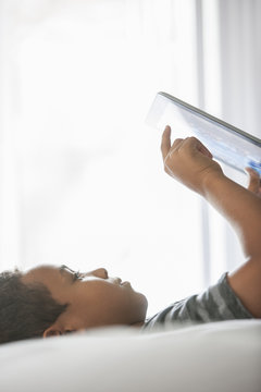 Boy using a tablet.
