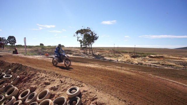 Low Aerial of Dirt Bikes and ATV on Track
