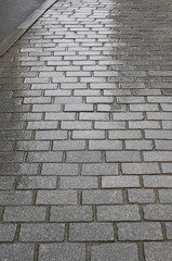 Hintergrund regennasses Granitpflaster