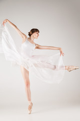 Ballet dancer in white tutu posing