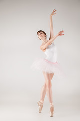 Fototapeta na wymiar Ballet dancer in white tutu posing