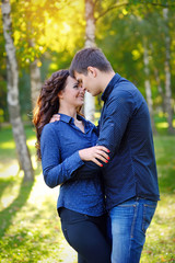 Fototapeta premium Romantic Teenage Couple By Tree In Autumn Park