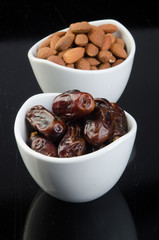 dates and almonds on a background
