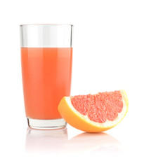 Studio shot of grapefruit juice and quarter isolated on white