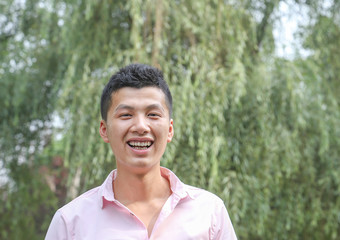 young man laugh outdoor