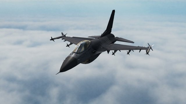 Fighter Jets F-16 flys over the clouds - close up
