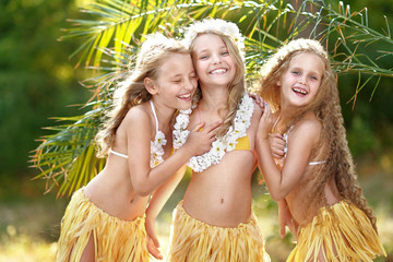 portrait of three girls in a tropical style