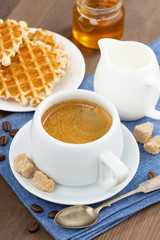 cup of coffee, waffles and honey, selective focus
